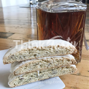 Crisp biscotti filled with lots of pecans and coated with sweet bourbon glaze, it's a cocktail flavored treat!