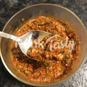 Pesto made with roasted red pepper, parsley, walnuts, and parmesan