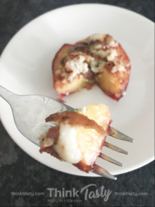 Broiled peach halves topped with blue cheese and bacon