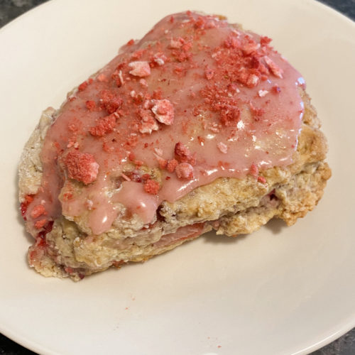 Scones filled and frosted with strawberries