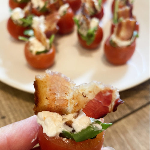 Cherry tomatoes stuffed with bacon, lettuce, and cheese