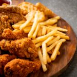 fried chicken with french fries and nuggets meal