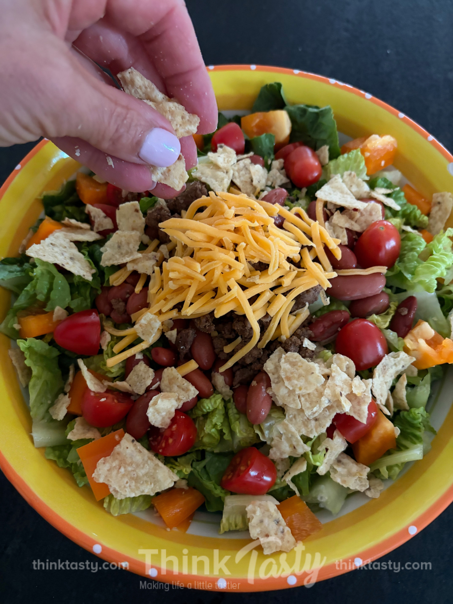 taco salad with tortilla chips and cheese