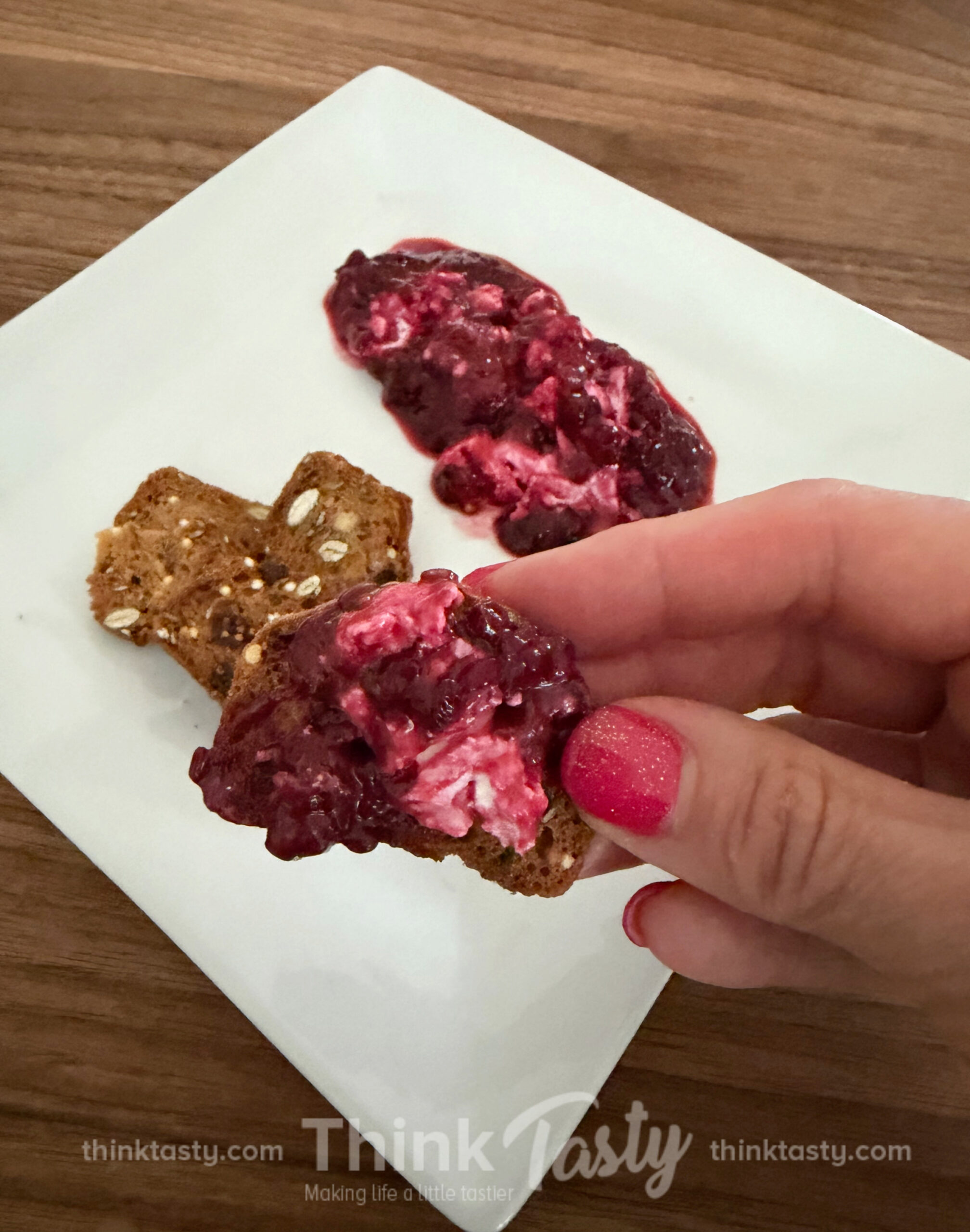 goat cheese dip with blackberry compote on crackers
